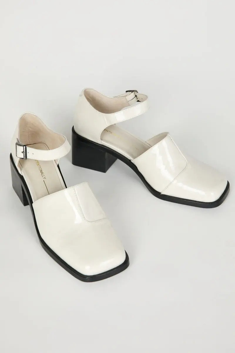 IB MARTY PATENT MARY JANE HEELS IN WHITE